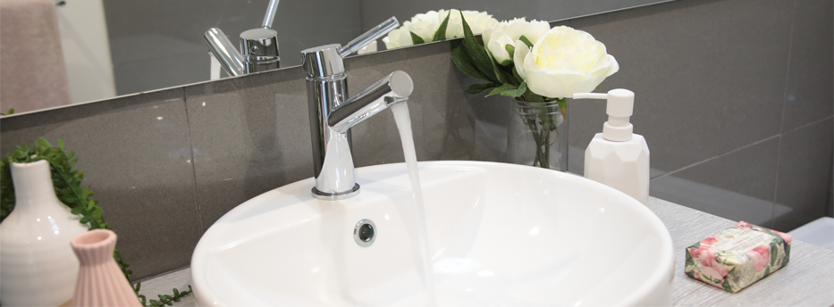 Water running out of tap in bathroom