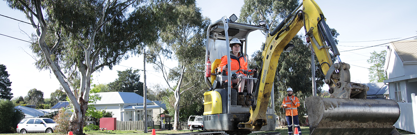 Staff member on digger